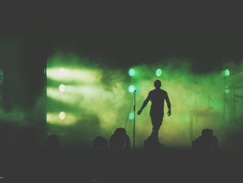 Blurred motion of woman at night