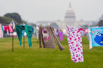 Clothes drying on clothesline against sky