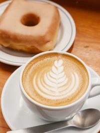 Close-up of cappuccino on table