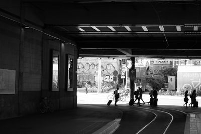 People on road in city