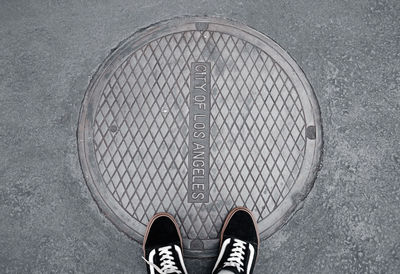 Low section of person standing on street