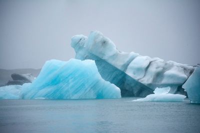 Scenic view of frozen lake against sky