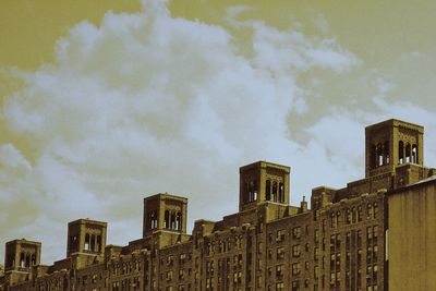 Low angle view of buildings in city against sky
