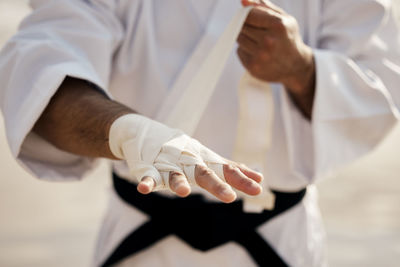 Midsection of doctor examining patient