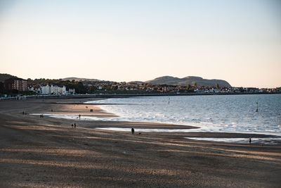 Scenic view of beach against clear sky