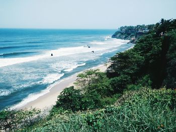 View of calm beach against clear sky