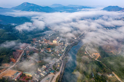 Aerial view of cityscape against sky