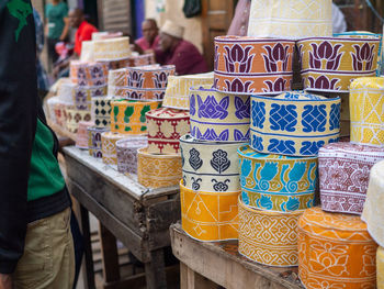 Multi colored potteries for sale at market stall