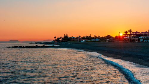 Scenic view of sea against sky during sunset