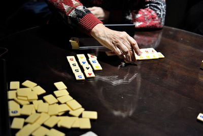 High angle view of man playing with chips on table