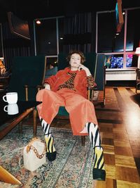 Portrait of smiling girl sitting on chair