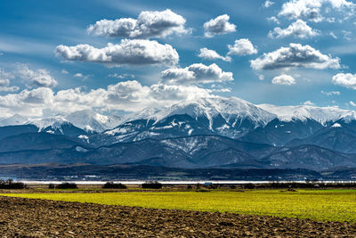 Scenic view of snowcapped mountains against sky