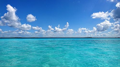 Scenic view of sea against blue sky