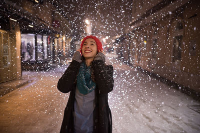 Portrait of young woman in winter at night