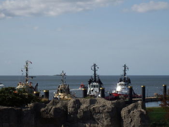 Panoramic view of sea and buildings against sky