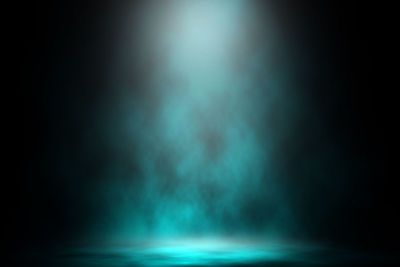 Illuminated sea against sky at night