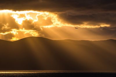 Scenic view of mountains against sky during sunset