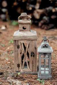Close-up of old lantern on field