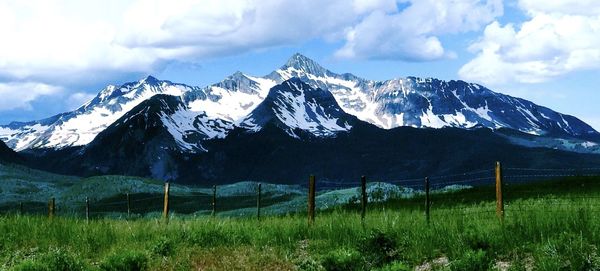 Scenic view of snowcapped mountains against sky