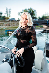Beautiful young woman in boat