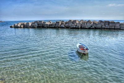 Boat in sea against sky