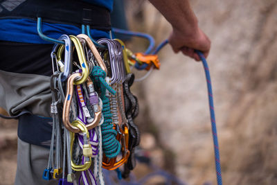 Midsection of hiker with safety harness