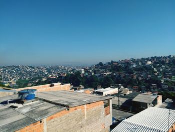 High angle view of cityscape against clear blue sky