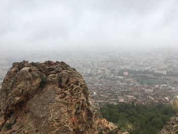 Aerial view of cityscape against sky