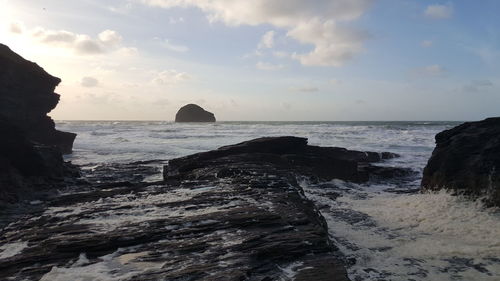 Scenic view of sea waves against sky