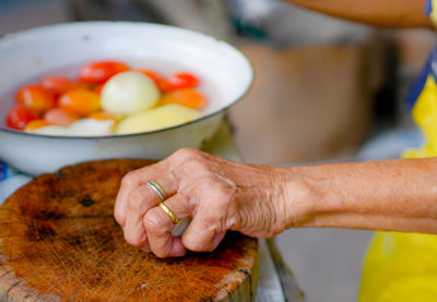 Cropped image of person preparing food