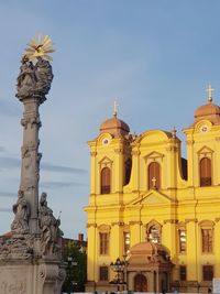 Low angle view of statue against building