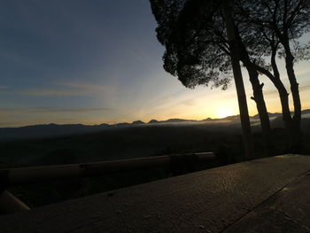 Scenic view of silhouette landscape against sky during sunset