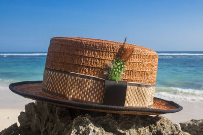 Close-up of rocks on beach against clear sky