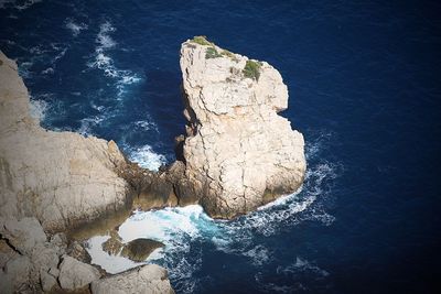 High angle view of rock formation in sea