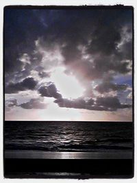 Scenic view of sea against cloudy sky