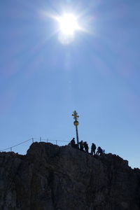 Low angle view of rock formation against sky on sunny day