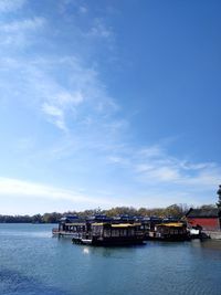 Scenic view of river against blue sky