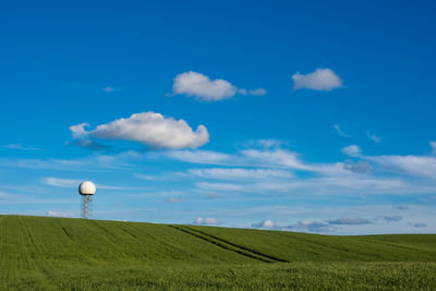 Scenic view of field against sky and radar