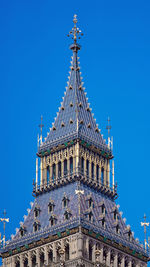 Low angle view of historical building against blue sky