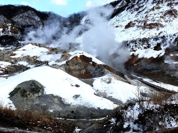 Scenic view of mountains against sky during winter