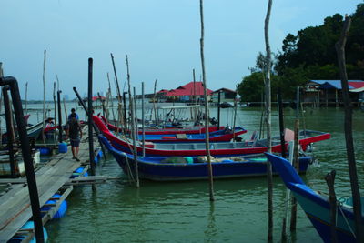 Boats moored at harbor