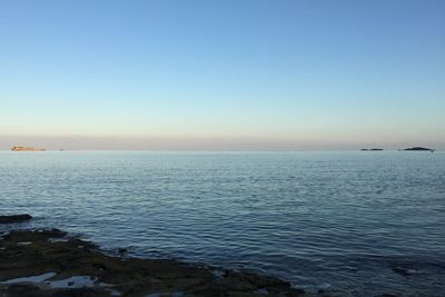 Scenic view of sea against clear sky