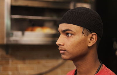 Side view of young man looking away