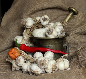 Mortar and pestle with garlic and red chili