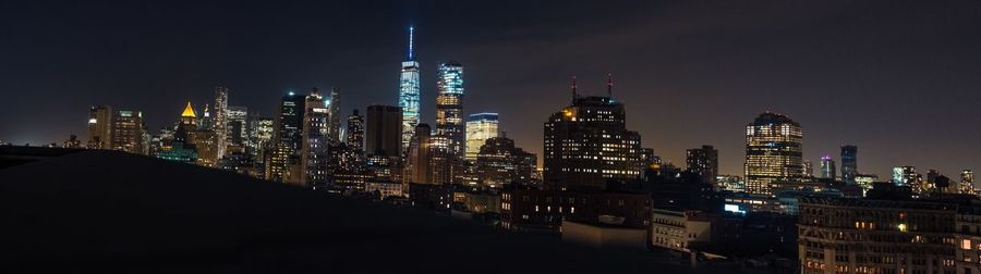 View of skyscrapers lit up at night