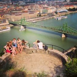 High angle view of people relaxing at river