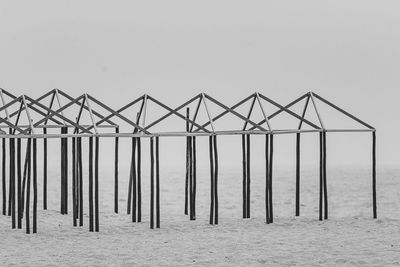 Lifeguard hut on beach against clear sky