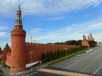 Tower amidst buildings against sky in city