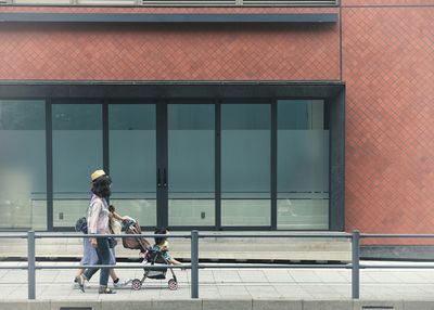 Woman standing in front of building