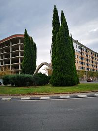 Road by building against sky